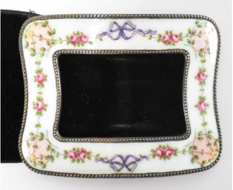 A hallmarked silver and enamel belt buckle. The buckle having white &amp; pink enamel with hand painted roses and bows over w