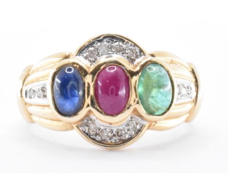 A 14ct gold sapphire, ruby, emerald and diamond ring. The tutti fruitti ring set with three oval cabochons to the centre with