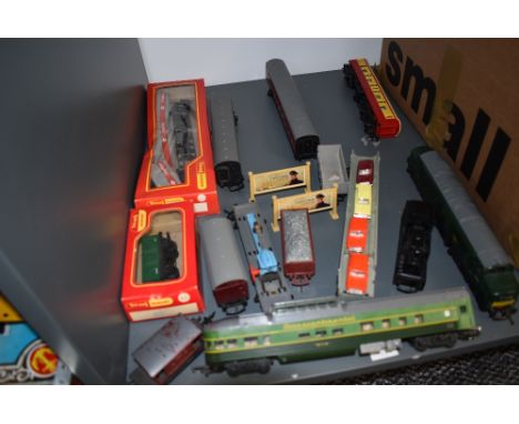 A shelf of Hornby and similar 00 gauge including 0-4-0 BR Loco, Diesel Loco D6830, Car Transporter with 4 cars, Transcontinen