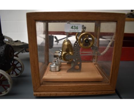 A well engineered German Stirling Technik style Live Steam Twin Cylinder Engine, missing name plate, on wood plinths in plast