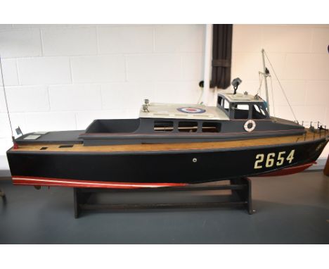 A hand built wooden Futaba radio controlled model RAF Air Sea Rescue launch boat, numbered 2654, on wood plinth, length 90cm