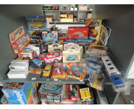 A shelf of modern diecasts including Corgi, Ertl, Solido, Days Gone etc, all boxed