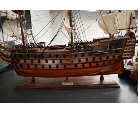 A scratch built wooden model, HMS Victory, fully rigged, on wood plinth, Height 75cm, length 100cm