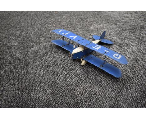 A Meccano hand built model Bi-Plane, G-EVTX in blue and white with pilot