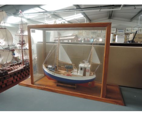 A modern wooden model Sail Boat Norden T78 in glass case,  overall dimensions of case height 36cm, depth 19cm and width 60cm