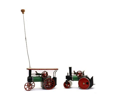 A Mamod TE1A steam traction engine, with burner, scuttle, funnel and steering rod 25.5cm wide 68.5cm high together with a Mam
