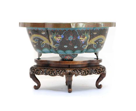 A Chinese cloisonné planter,20th century, of lobed lozenge form on four bracket feet, decorated with dragons chasing a flamin