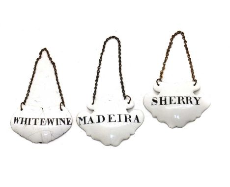 A group of three enamelled wine labels19th century, comprising 'White-Wine', 'Madeira' and 'Sherry', each with chain suspensi