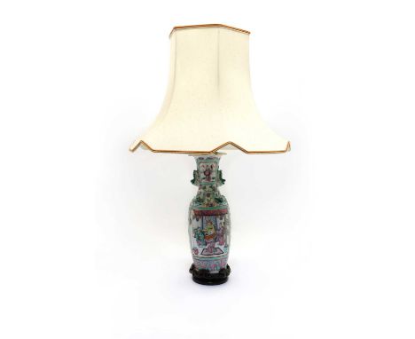 A Chinese porcleain famille rose vase19th century, of tapering form, flanked by two tiger handles, decorated with figural sce