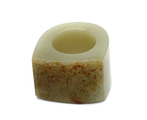 A Chinese jade archer's ring,20th century, D shaped, the flat rectangular side carved with a chilong, the stone of greyish wh