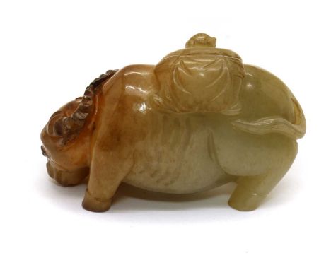 A Chinese jade carving,20th century, of two boys bathing a buffalo, the stone of greyish tone with inclusions, 7.5cm longCond