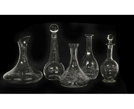 A collection of glass decanters and carafes,of recent manufacture, to include a Lalique example with a fluted frosted stopper