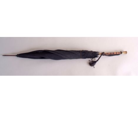 A fine 19th century German malacca umbrella, the straight handle with foliate-engraved gilt metal pommel, the underside with 