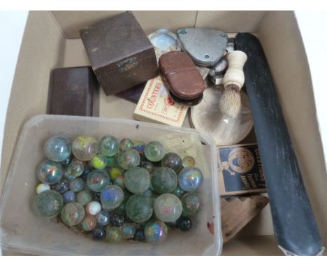 A mixed lot of items including marbles, and ivory shaving brush, playing cards, sewing set