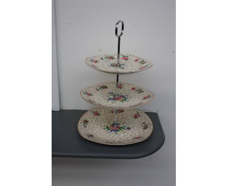 A Midwinter Stylecraft Staffordshire three tier cake stand of floral and gilt design, 40cm