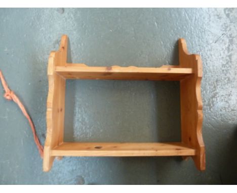 A pine side cabinet, two drawers beside shelf, raised on bracket feet, with A pine hanging shelf