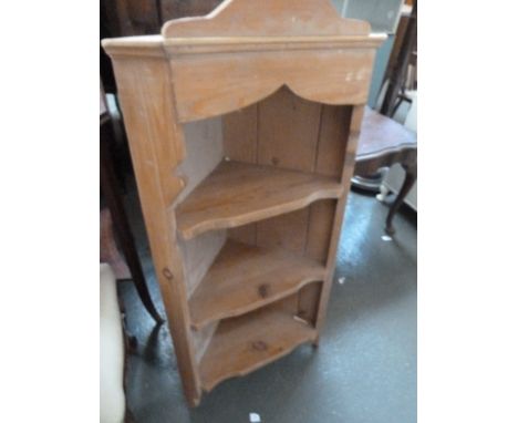 A pine hanging corner shelf, arched top over three shelves, 46cmW