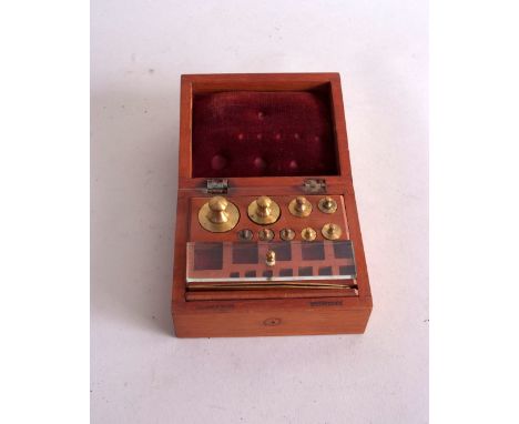 A pair of Victorian cased brass scales, by Baird & Tatlock, in wlanut case with accessories, together with a set of Becker & 