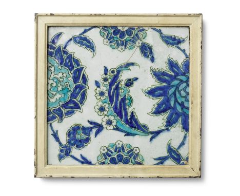 A large Iznik pottery tile Turkey, 17th Centuryof square form, decorated in cobalt blue and turquoise with black outline on a
