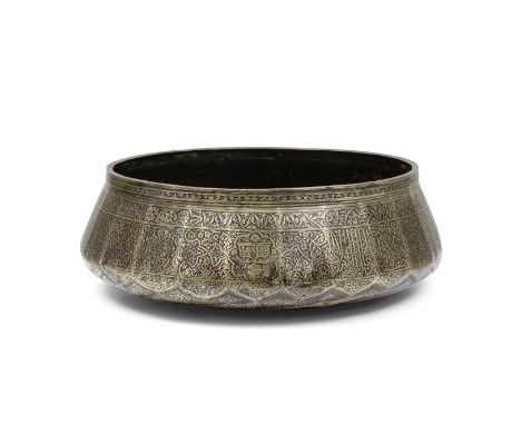 A rare Mamluk engraved brass basin from the reign of Sultan Qaytbay (reg. 1468-96) Egypt, late 15th Centuryof rounded multifa