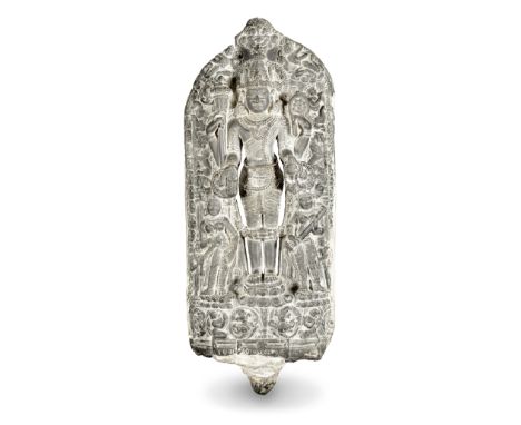 A Pala blackstone stele of Vishnu Northeastern India, Pala-sena period, circa 11th Centurystanding on a lotus pedestal, holdi