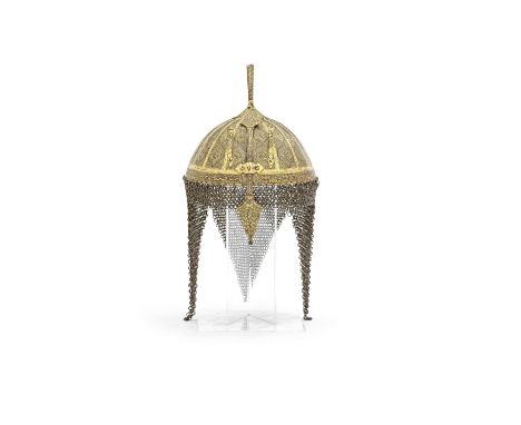 A gold-koftgari steel helmet (Khula-khud) North India, 19th Centuryof domed form surmounted by a plume holder, profusely engr