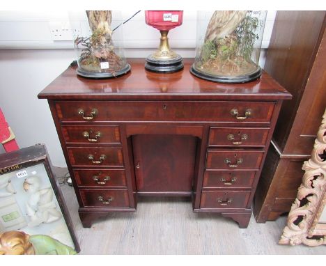 A George III revival crossbanded mahogany ladies twin pedestal desk of ten drawers with single door kennel cupboard on bracke