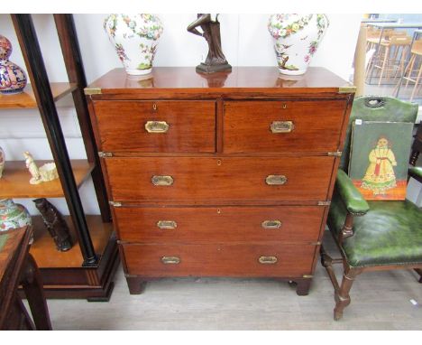 A 19th Century mixed wood straight front two-piece military chest of two short over three long drawers, with brass corner mou