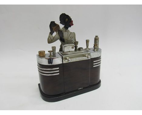 A Ronson Art Deco table lighter in the form of barman and Deco bar, 19cm x 16cm