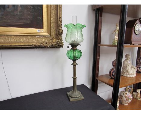 A Victorian tall brass oil lamp with green glass reservoir and similar rippled shade, approximately 79cm tall 