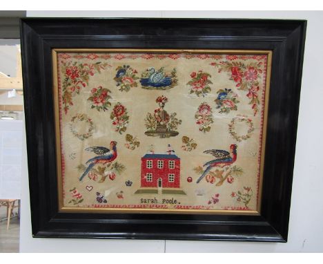 A Victorian Berlin work style pictorial sampler, worked in colours on a canvas ground, with a red brick house, parrots, swan 