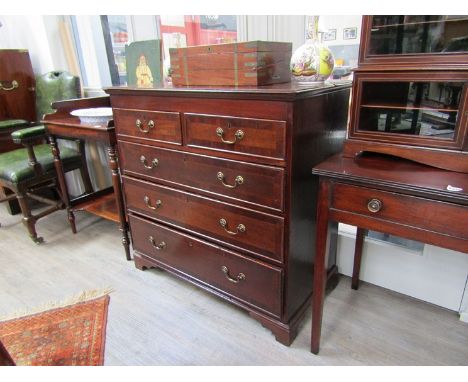 Circa 1760. an oak chest of two short over three graduating long drawers with mahogany crossbanding and brass swan neck handl