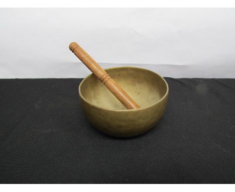 A 19th Century Chinese singing bowl with wooden stick, 16.5cm diameter