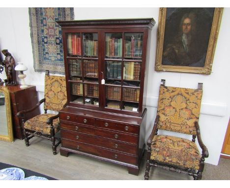 A late Georgian mahogany library bookcase, the moulded dentilled cornice above twin astragal-glazed doors, enclosing divided 