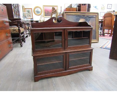 An Edwardian line inlaid mahogany counter table top display cabinet with key, the swan neck pediment over four glazed doors o