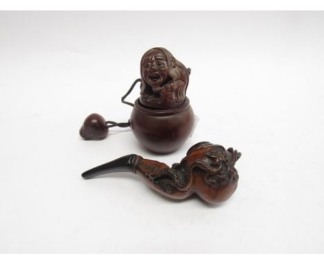 An Opium pipe and container 