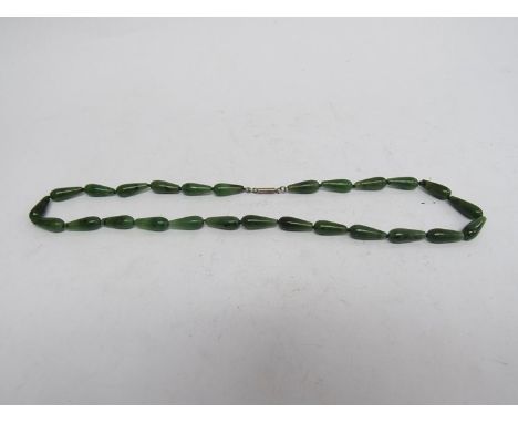 A row of Spinach jade tear drop beads 
