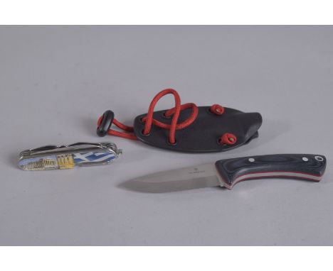 A VICTORINOX KNIFE 5.75ins long in a leather sheaf and an O/K ABEP Swiss knife.
