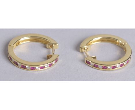 A PAIR OF 18CT RUBY AND DIAMOND HOOP EARRINGS.