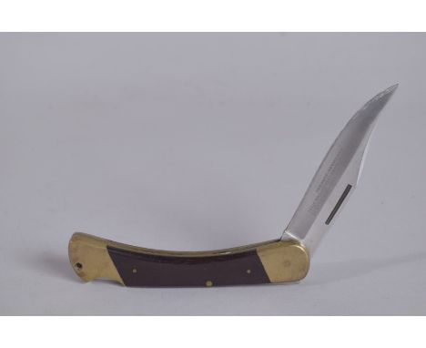 A VICTORINOX 970 PUMA GAME WARDEN FOLDING KNIFE with leather case.