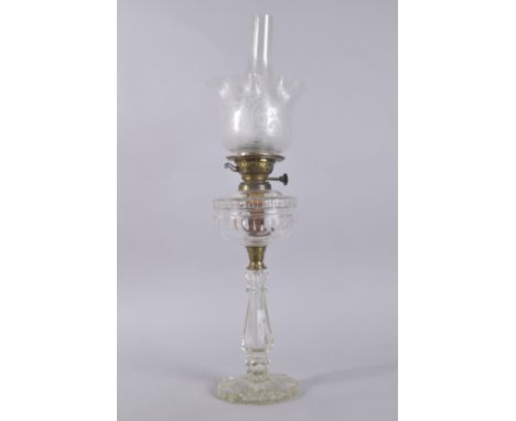 A GOOD VICTORIAN CUT GLASS OIL LAMP, Youngs Patent, with etched glass shade and plain funnel. Base: 19ins high.