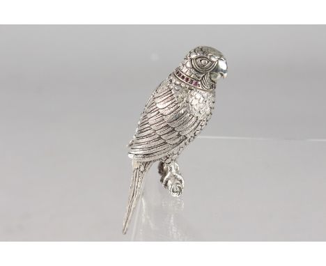 A SILVER PLATED PARROT SCENT BOTTLE with a ruby collar.