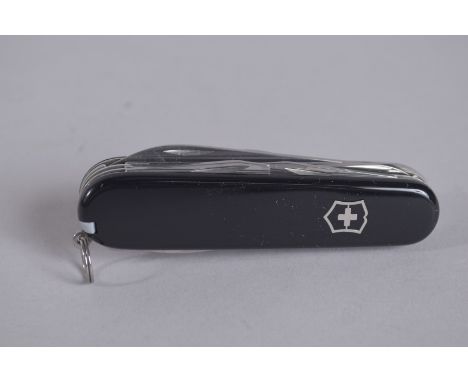 A VICTORINOX SWISS FOLDING FOUR PIECE KNIFE.
