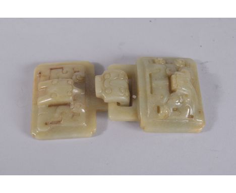 A CHINESE JADE BUCKLE, in two parts.