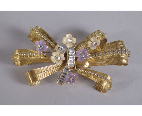 DOLCE AND GABBANA, MADE IN ITALY A GILT METAL DIAMOND AND ENAMEL FLOWER HEAD BROOCH, signed.