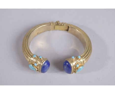 A STERLING SILCER LAPIS TURQUOISE BANGLE.