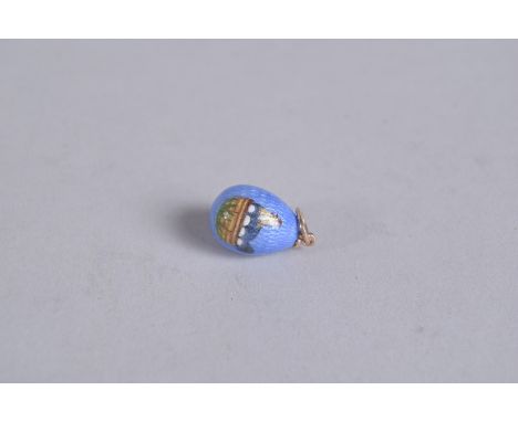 A SILVER AND ENAMEL CHICK EGG PENDANT.