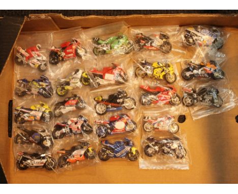 Twenty three unboxed 1/24th scale racing motorcycles, all different models