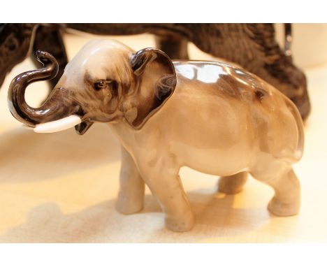 Royal Doulton Elephant with trunk in salute in grey and black colourway, model number HN2644. H: 11 cm