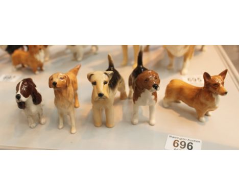 Five Beswick dogs including Cocker Spaniel, Corgi, Retriever, Beagle and Lakeland Terrier, model numbers; 1754, 1736, 2448, 1